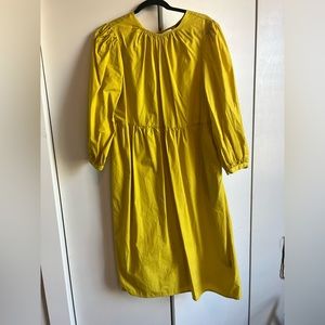 WHO WHAT WEAR Yellow midi dress with open back ties and billow sleeves. Size M